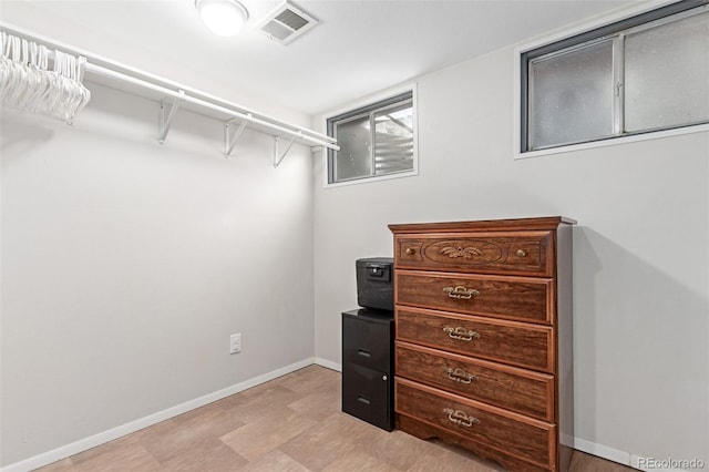 walk in closet featuring visible vents