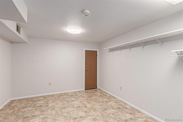 below grade area with visible vents and baseboards