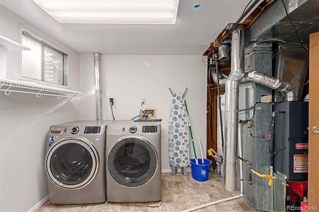 clothes washing area with laundry area and independent washer and dryer