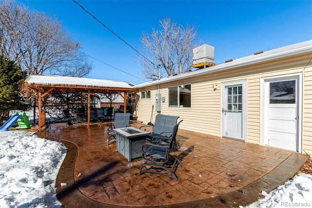 deck with a patio area and an outdoor fire pit