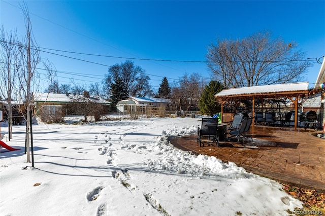 snowy yard with fence