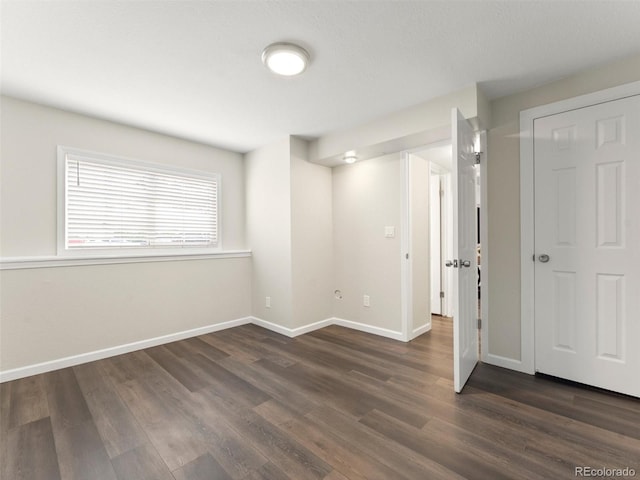 16986 E Piedmont Dr Unit A, Aurora, CO 80015 - spare room featuring dark wood finished floors and baseboards