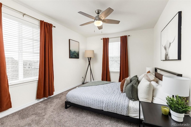bedroom with baseboards, ceiling fan, and carpet