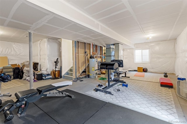 workout room featuring gas water heater