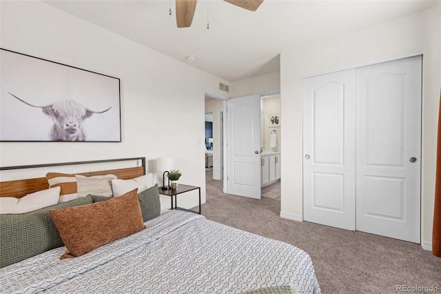 carpeted bedroom featuring visible vents, a ceiling fan, baseboards, and a closet