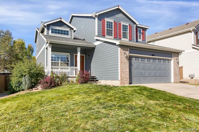 view of front facade with a porch, a front yard, and a garage