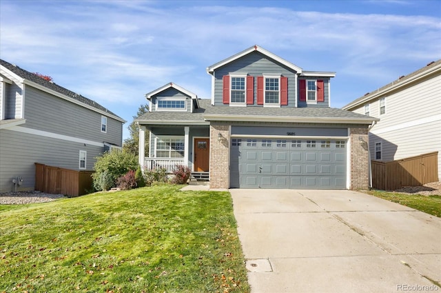 view of front property with a front yard, a garage, and a porch