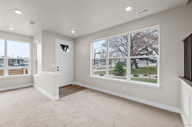 9457 W 58th Ln Unit A, Arvada, CO 80002 - entrance foyer featuring light colored carpet and recessed lighting