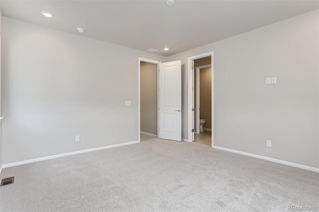 9457 W 58th Ln Unit A, Arvada, CO 80002 - unfurnished bedroom featuring carpet flooring, ensuite bath, and recessed lighting