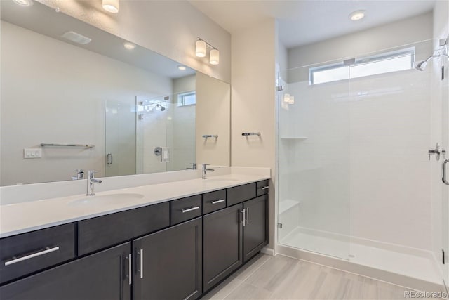 9457 W 58th Ln Unit A, Arvada, CO 80002 - bathroom featuring a shower stall and double vanity