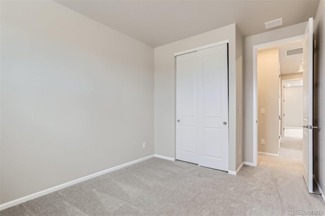 9457 W 58th Ln Unit A, Arvada, CO 80002 - unfurnished bedroom featuring light carpet and a closet