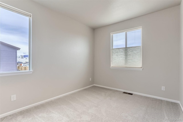 9457 W 58th Ln Unit A, Arvada, CO 80002 - carpeted empty room featuring baseboards