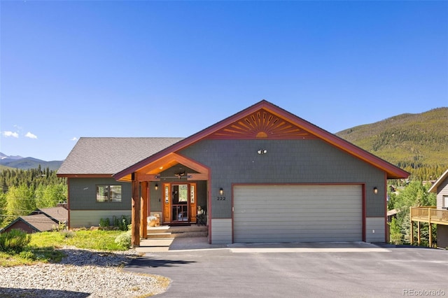 222 Idlewild Dr, Dillon, CO 80435 - view of front of house featuring a mountain view and an attached garage