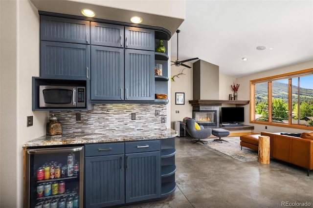 222 Idlewild Dr, Dillon, CO 80435 - kitchen with open shelves, stainless steel appliances, open floor plan, concrete flooring, and recessed lighting