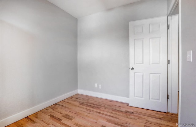 spare room featuring light wood-type flooring