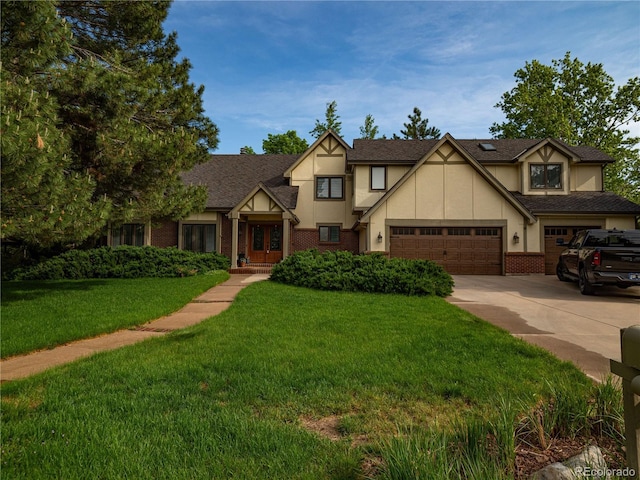 15395 E Penwood Pl, Aurora, CO 80015 - english style home with driveway, stucco siding, a front lawn, french doors, and an attached garage
