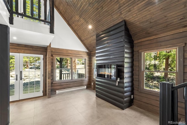 46 Silver Creek Rd, Idaho Springs, CO 80452 - unfurnished sunroom featuring a baseboard radiator, lofted ceiling, and french doors