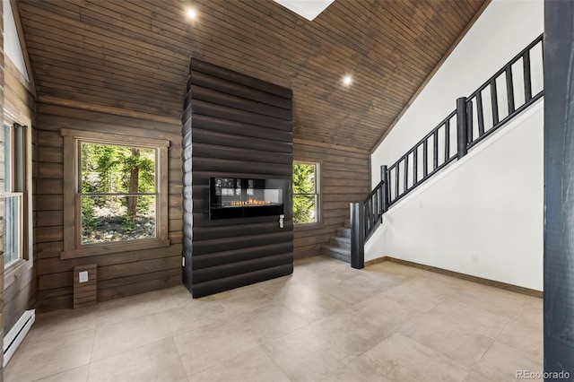 46 Silver Creek Rd, Idaho Springs, CO 80452 - entrance foyer featuring healthy amount of natural light, high vaulted ceiling, baseboard heating, wooden ceiling, and stairs