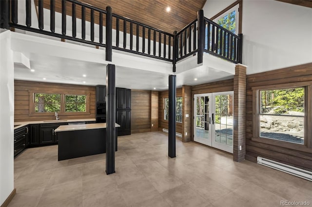46 Silver Creek Rd, Idaho Springs, CO 80452 - interior space with a high ceiling, healthy amount of natural light, french doors, a baseboard radiator, and recessed lighting