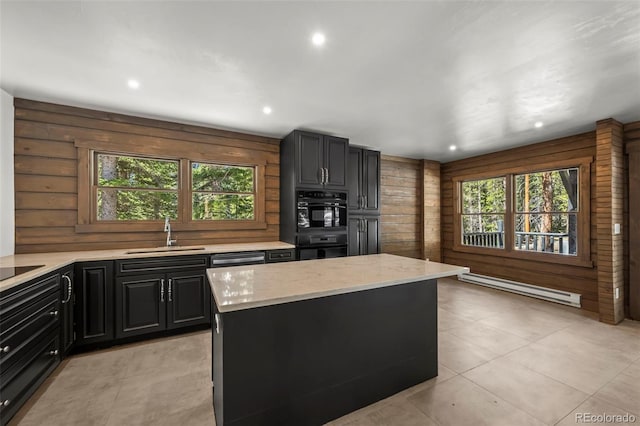46 Silver Creek Rd, Idaho Springs, CO 80452 - kitchen with baseboard heating, oven, light stone countertops, a kitchen island, and recessed lighting