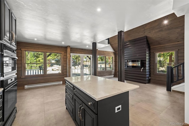 46 Silver Creek Rd, Idaho Springs, CO 80452 - kitchen featuring baseboard heating, oven, a kitchen island, recessed lighting, and light stone countertops