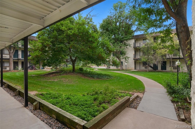 surrounding community featuring a lawn