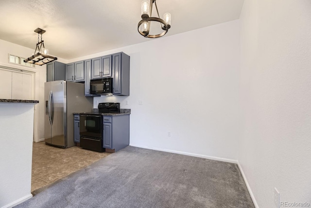 kitchen with hanging light fixtures, light carpet, black appliances, gray cabinetry, and a chandelier