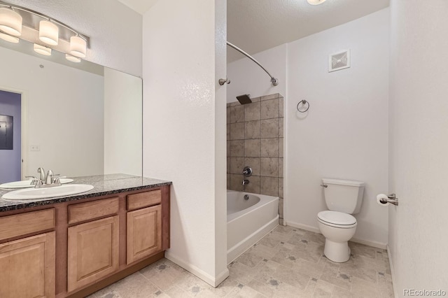 full bathroom with toilet, tile patterned floors, vanity, and tiled shower / bath