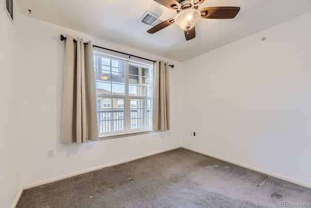 unfurnished room featuring carpet flooring, ceiling fan, and a wealth of natural light