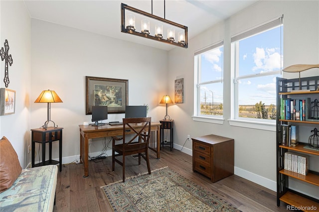 office with dark wood-type flooring