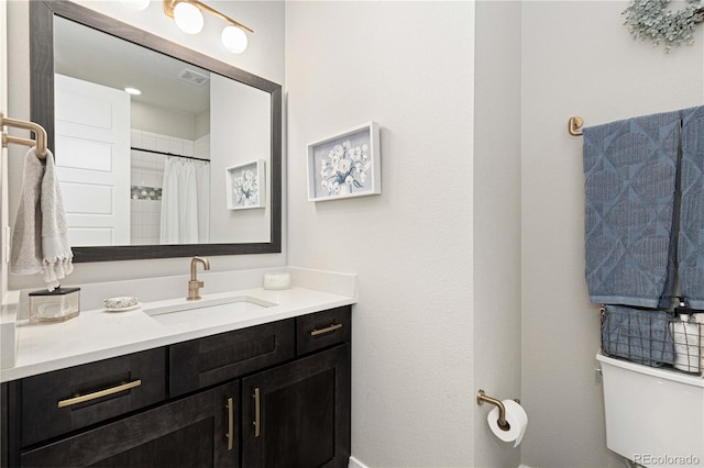 bathroom with vanity and toilet