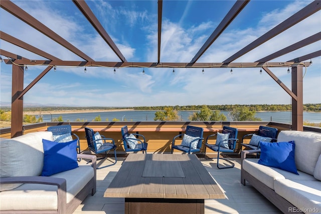 wooden deck with an outdoor hangout area, a pergola, and a water view