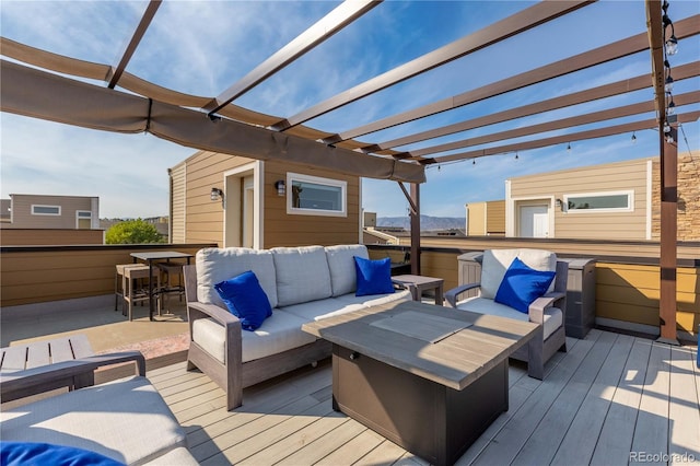 wooden deck featuring an outdoor hangout area and a pergola