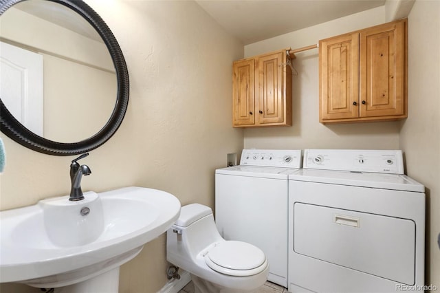 1510 York Rd Unit 101, Colorado Springs, CO 80918 - bathroom with separate washer and dryer, a sink, and toilet