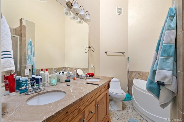 1510 York Rd Unit 101, Colorado Springs, CO 80918 - full bathroom with a shower with door, double vanity, toilet, speckled floor, and a bath
