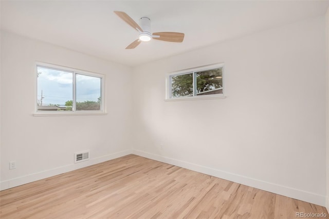 1948 S Zenobia St, Denver, CO 80219 - empty room featuring healthy amount of natural light, light wood-style flooring, and a ceiling fan