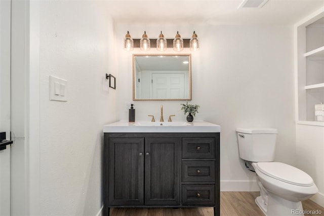 1948 S Zenobia St, Denver, CO 80219 - bathroom with wood finished floors and vanity