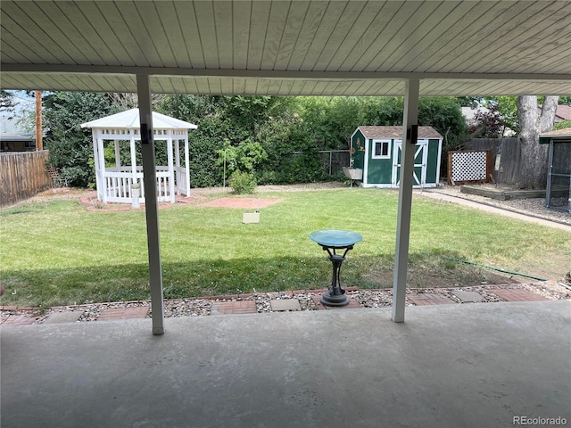 1948 S Zenobia St, Denver, CO 80219 - fenced backyard featuring a shed, a gazebo, and a patio area