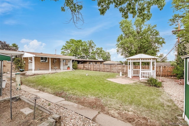 1948 S Zenobia St, Denver, CO 80219 - fenced backyard featuring a gazebo and a patio area