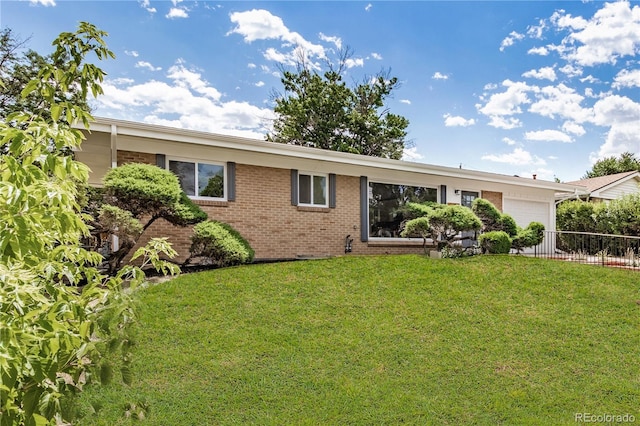 1948 S Zenobia St, Denver, CO 80219 - view of front of property with an attached garage and brick siding
