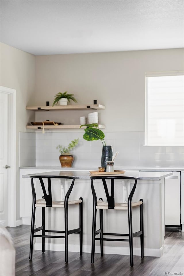 9490 W 14th Ave Unit 3, Lakewood, CO 80215 - bar featuring dark wood-style floors and white dishwasher