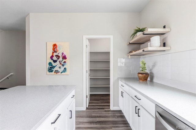 9490 W 14th Ave Unit 3, Lakewood, CO 80215 - kitchen with open shelves, stainless steel dishwasher, dark wood-type flooring, and white cabinetry