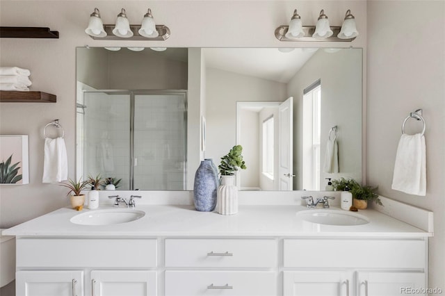 9490 W 14th Ave Unit 3, Lakewood, CO 80215 - bathroom with double vanity, a stall shower, and lofted ceiling