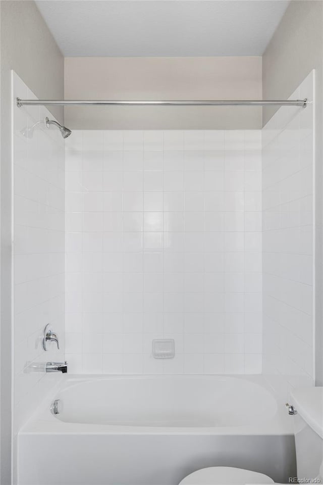 9490 W 14th Ave Unit 3, Lakewood, CO 80215 - bathroom featuring toilet and  shower combination