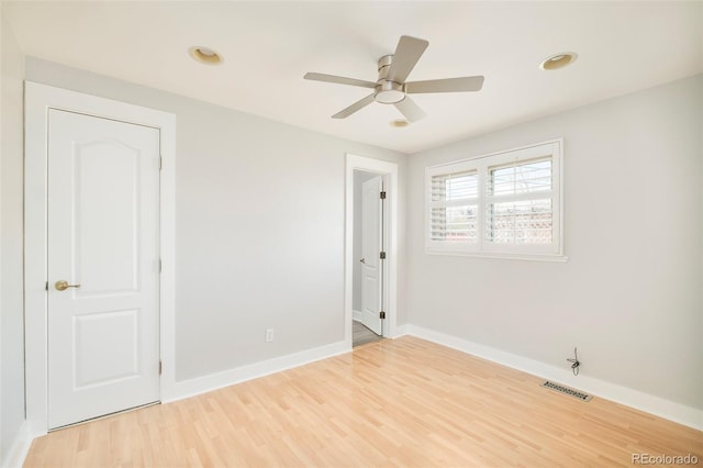 unfurnished bedroom with light wood-style floors, visible vents, baseboards, and recessed lighting