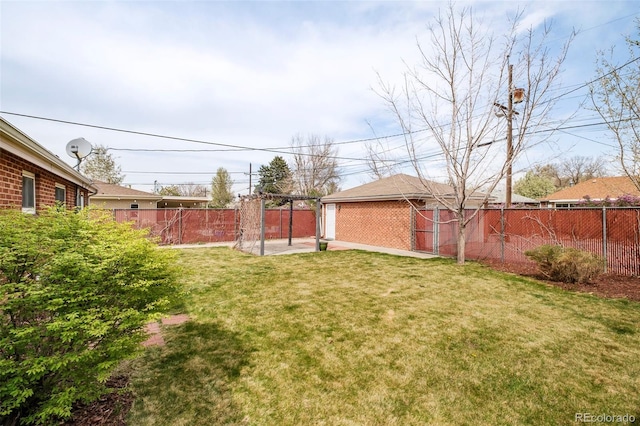 view of yard with a fenced backyard