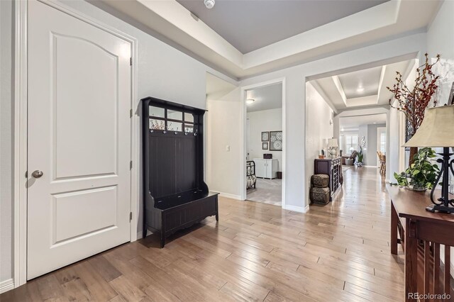 15211 Quince St, Thornton, CO 80602 - entrance foyer featuring a raised ceiling, light wood finished floors, and baseboards