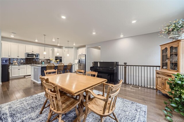 15211 Quince St, Thornton, CO 80602 - dining space featuring recessed lighting and wood finished floors