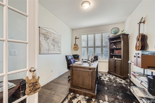 15211 Quince St, Thornton, CO 80602 - office area featuring wood finished floors and baseboards