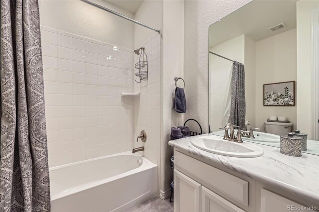 15211 Quince St, Thornton, CO 80602 - full bath with shower / tub combo, vanity, toilet, and a textured wall